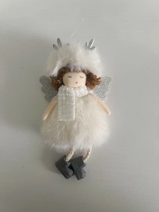 Detail view of a Christmas angel ornament with white plush dress and silver wings