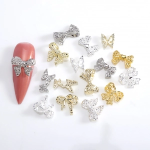 Bowknot 3D metal nail art charms in gold and silver finish with sparkling rhinestones