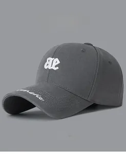 Detail of dark grey cotton baseball cap with white 3D letter embroidery and breathable holes