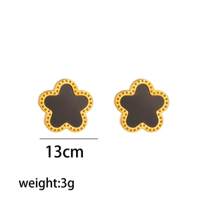 Titanium steel flower earrings with grey shell inlay and gold plating on white background