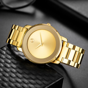 Detail view of a gold minimalist watch with a black dial on a premium gift box