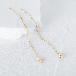Detailed close-up of S925 silver butterfly tassel earring with gold finish and zircon