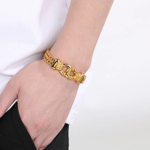 Golden titanium steel bracelet for men with vintage totem engraving on male wrist