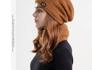 Detailed knit texture of winter thermal beanie and neck warmer set in camel brown color
