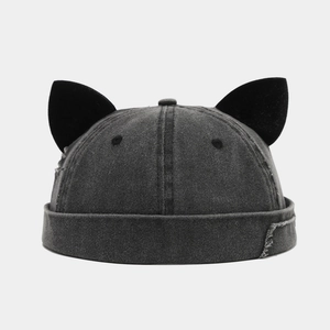 Vintage dark gray washed denim docker cap with cat ear accents and distressed edges
