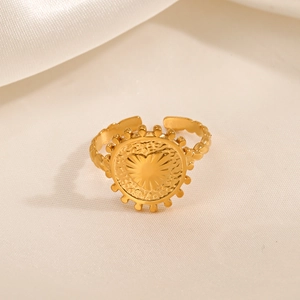 18K gold plated stainless steel open ring with heart sunburst texture on warm white fabric