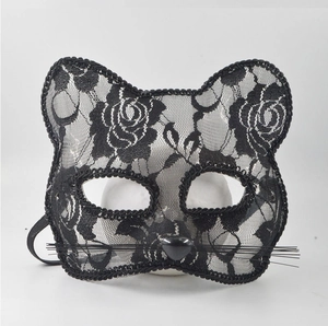 Detail of elegant black lace cat mask with floral patterns and delicate whiskers