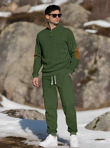 Detail of olive green knitted track suit with quilted texture and standing collar button
