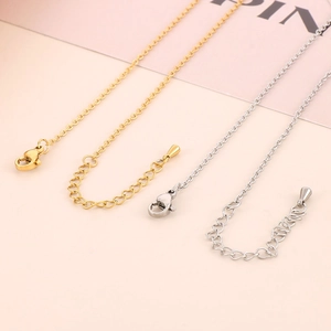Detail of adjustable metal lobster clasp and extension chain for gold and silver necklaces