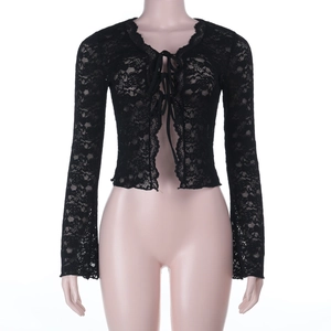 Detail of black floral lace cardigan featuring elegant bell sleeves and front tie closure