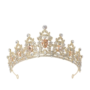 Detailed close-up of luxury gold crown featuring champagne gems and sparkling crystals
