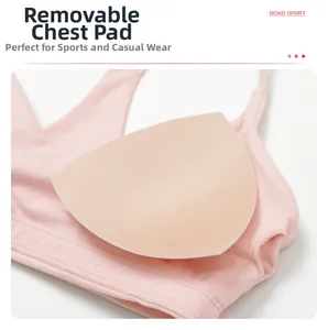 Detail of pink yoga bra showing high-stretch fabric and removable padded inserts