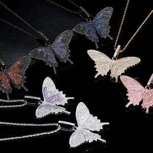 Close-up of hip-hop butterfly pendants with micro-paved cubic zirconia in multiple colors