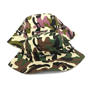 Detail of camouflage bucket hats with metal eyelets and adjustable sport drawstring