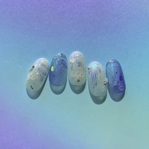 Deep blue jellyfish themed press-on nails with glitter, rhinestones and elegant gradients