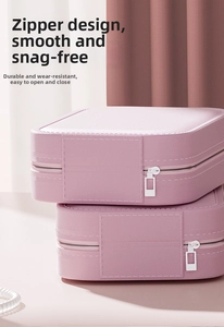 Close-up of pink PU leather makeup box with smooth zipper and durable textured finish