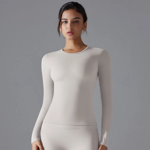 Close-up of slim-fit long sleeve yoga top featuring high-elastic breathable fabric