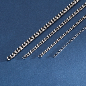 Detailed view of silver stainless steel Cuban link chains in various thicknesses