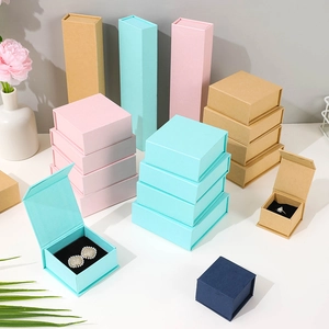 Assorted magnetic jewelry gift boxes in various sizes and pastel colors on a white surface