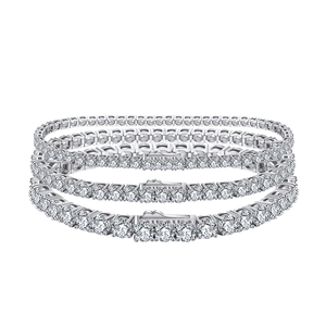 Three-layer stacked silver tennis bracelets featuring white cubic zirconia in varying widths