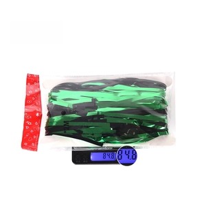 Detailed view of 1M*2M green and black fringe curtain party backdrop on a scale