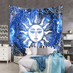 Detail of sun and moon mandala tapestry hanging as a bohemian wall art background