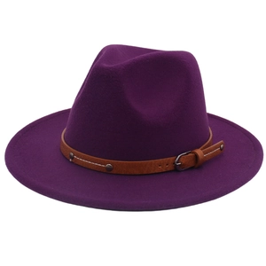 Close-up of purple wool fedora hat featuring a brown leather belt with silver studs