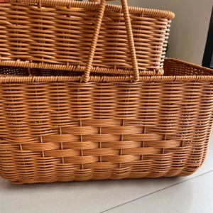 Macro detail of natural tan woven storage basket with reinforced handles and texture