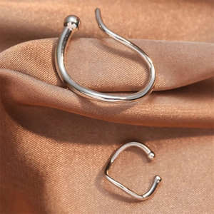 Silver geometric ear cuff set featuring long irregular wrap and small C-shaped clip on satin