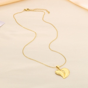 Elegant gold stainless steel 3D heart pendant necklace with O-chain link on silk fabric