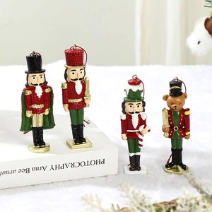 Set of four resin Christmas nutcracker soldier hanging ornaments in red and gold