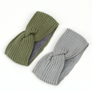 Detail of chunky knit headband with warm fleece lining and stylish cross-knot texture