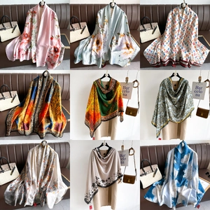 Collage of long elegant satin scarves featuring various floral and luxury patterns