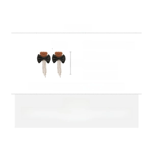 Detailed view of bear bow tassel earrings with dimensions 7x3.5cm and 8g weight