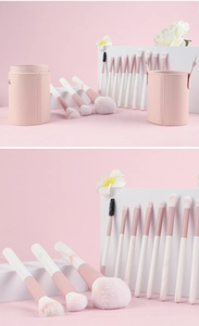 Detail of 12-piece pink marble makeup brush set with elegant cylindrical leather storage case