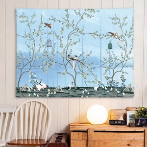 Detail of wall tapestry featuring cranes and white flowers on a light blue background