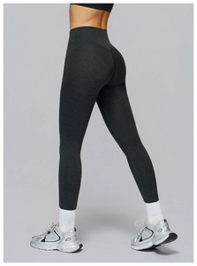 Detail of high-waist yoga leggings featuring V-shaped stitching and heathered grey fabric