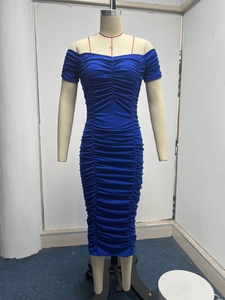 Detailed view of the blue off-shoulder dress with fine smocked texture and bodycon fit