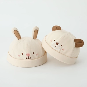 Cute beige cotton baby hats featuring bunny and bear animal designs with small ears