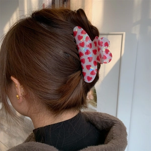 Sweet heart print hair claw clip modeled on hair showing realistic styling effect
