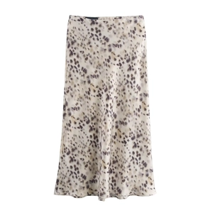Detail of silky satin leopard print midi skirt with high-waist cut on white background