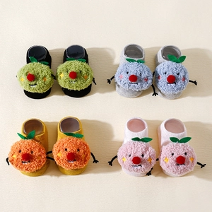 Detailed grid of 3D cartoon baby socks with non-slip soles in four neutral colors