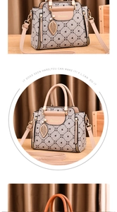 Detail of elegant handbag showing geometric texture and pearl leaf pendant on wooden desk