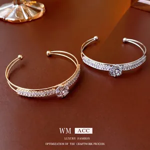 Elegant gold and silver flower bangle set with zircon inlay and double band design