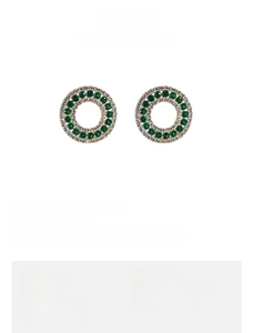 Detail showing 1.7cm round gold earrings with green cubic zirconia and pavé stones