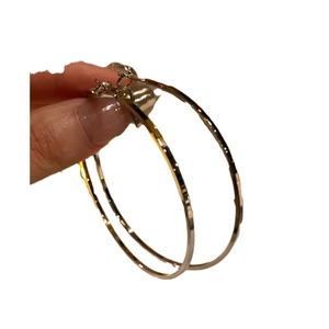 Large golden circular hoop earrings in minimalist metal design for women stylish look