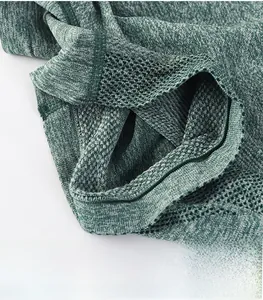 Macro detail of breathable moisture-wicking fabric and seamless yoga shorts design