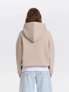 Oversized beige hoodie for women with drawstring hood and dropped shoulder design