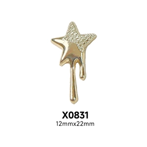 Detail of gold melting star nail art charm with rhinestones for punk DIY manicure designs