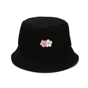 Black cotton bucket hat with delicate cherry blossom embroidery for sun protection